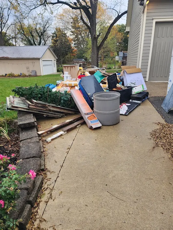 Dumpster being loaded with debris for 3 Yard Dumpster Rental in Lake Shore